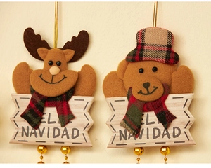 Detail of felt Christmas ornaments featuring reindeer and bear with wooden text signs