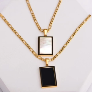 Golden Figaro necklaces with rectangular pendants in white shell and black agate inlay