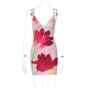 Detail of pink bodycon dress with red floral print and spaghetti straps on mannequin