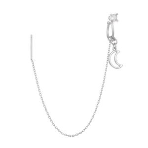 Macro view of silver moon pendant with zircon and delicate tassel chain detail