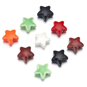 Macro shot of colorful star-shaped ceramic beads with hole for DIY jewelry making