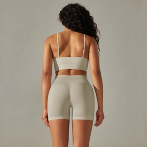 Detail of high-waist seamless yoga shorts with V-shaped texture for booty lifting effect