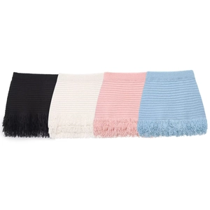 Detailed view of knitted fabric texture with fringe trim in black white pink and blue