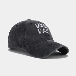 Close-up of vintage washed cotton baseball cap with white DOG DAD embroidery and paw print