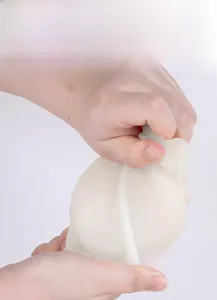Detail showing high flexibility of the translucent silicone angel candle mold being stretched