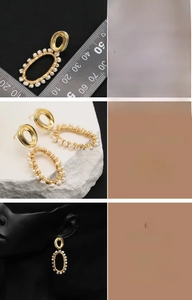 Macro detail of natural freshwater pearl drop earrings with 18K gold-plated wire wrapping