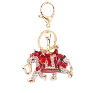 Sparkling rhinestone running elephant keychain with red enamel in gold metal finish