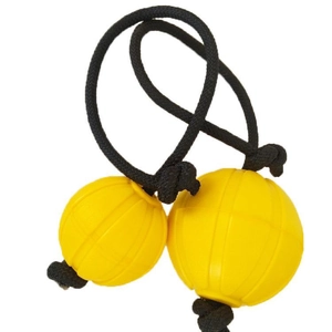 Close-up of yellow Asalato kashaka shaker with black cord on white background