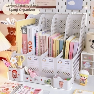Multi-compartment white desk organizer with vertical book slots and cartoon stickers