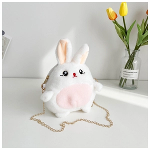 Detail of plush rabbit crossbody bag with white fur, pink accents and gold chain strap