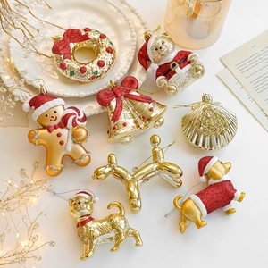 Christmas tree ornaments set featuring gold and red glitter gingerbread man and bell shapes