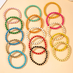 Colorful acrylic bead bracelets set with star charms and gold rhinestone accents