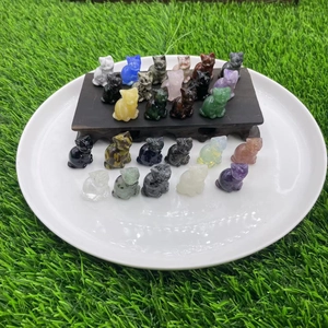 Detailed collection of assorted 1.2-inch carved gemstone cats on a white plate