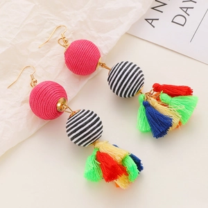 Bohemian woven tassel earrings with colorful yarn balls and ethnic handmade style