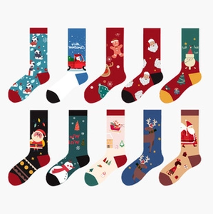 Flat lay set of ten colorful Christmas themed cotton socks featuring festive patterns