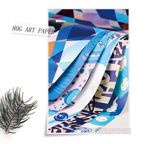 Detailed view of layered 80g blue geometric art wrapping paper with artistic pine decor