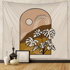Detail of bohemian tapestry featuring abstract mountains and monstera leaf designs