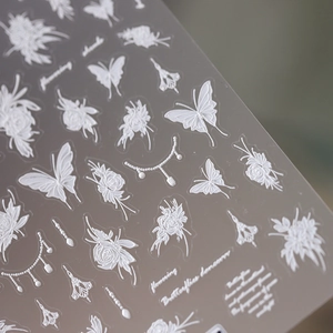 3D white embossed nail art stickers with butterfly and flower designs for DIY manicure