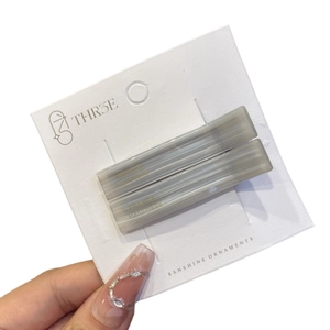 Minimalist marble grey resin hair clip set with gold label and handmade metal fastener