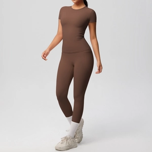 Detail view of high-elasticity dark brown yoga set with breathable short sleeve top and leggings