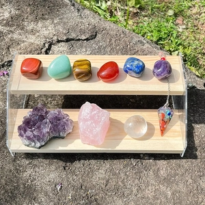 Natural healing crystal set with polished gemstones and raw clusters on a display stand