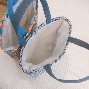 Floral canvas lunch tote bags with blue and gray handles and internal metal snaps