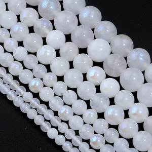 Moonstone iridescent round beads for DIY jewelry making in various sizes on black background