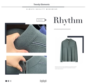 Detailed close-up of ribbed collar and metal quarter-zip on men's gray-green knit sweater