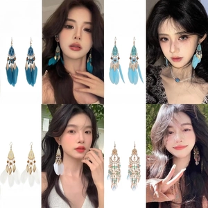 Bohemian style long handmade beaded feather and tassel drop earrings for women