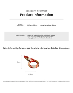 Detailed view of matte metal bracelet with colorful scarf ribbon tie and dimensions