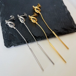 Vintage knotted tassel earrings in 18k gold and silver plating on black slate stone