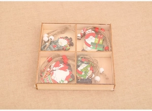 Set of four hand-painted Christmas wooden gnome ornaments in a wooden storage box