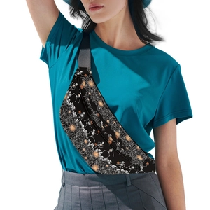 Close-up of Halloween fanny pack with skull and pumpkin prints worn by a model
