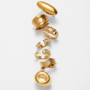 Set of 7 gold-plated stainless steel rings with zirconia and unique geometric patterns