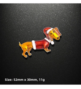 Detail of dachshund Christmas brooch with red hat and enamel finish in 52mm x 30mm size