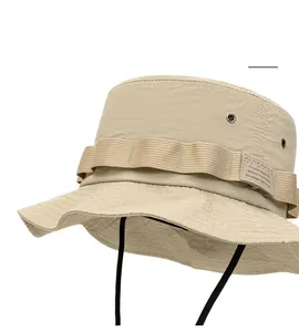 Detail of khaki outdoor sun hat featuring side ventilation eyelets and adjustable chin strap