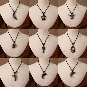 Maori style resin pendants collection featuring turtle, dolphin, and tribal hook designs
