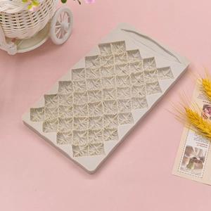 Pineapple texture silicone mold for DIY cake decoration on pink background