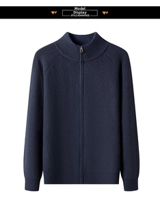 Close-up of men's dark blue rib-knit cardigan with metal zipper and collar detail