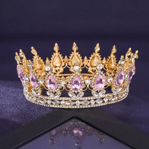 Detailed view of luxury gold bridal crown with pink teardrop stones and clear rhinestones