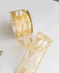Macro detail of champagne gold mesh ribbon with white cedar print and gold wire edges