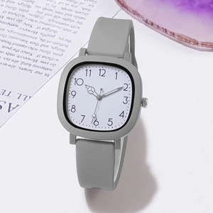 Detailed close-up of a square grey silicone student watch with digital dial display
