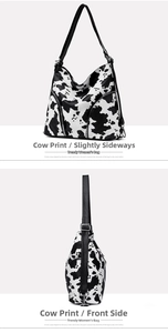 Detail view of large tote bag with cow print pattern and symmetrical metal zippers