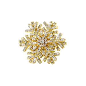 Golden snowflake brooch with inlaid crystals and zircons shown from a top-down view
