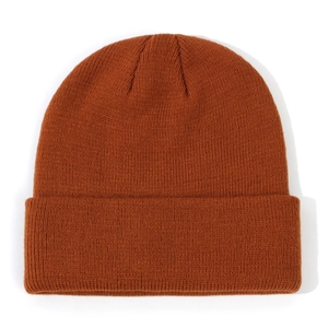 Close-up of a rust-colored knitted beanie hat for toddlers in winter