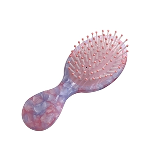 French vintage pink marble acetate hair comb with cushioned paddle brush design