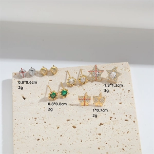 Set of gold and silver studs featuring heart, star, flower and butterfly motifs