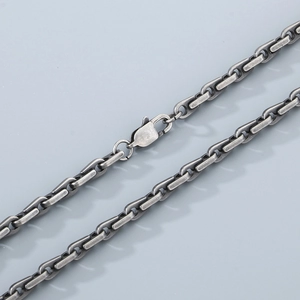 Detail of vintage oval bamboo chain link with lobster clasp on stainless steel necklace