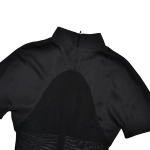 Detail view of the high neck mesh paneling and back zipper on this black slim dress