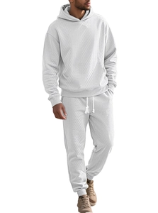 Detailed view of white men's tracksuit with textured waffle jacquard fabric and hood